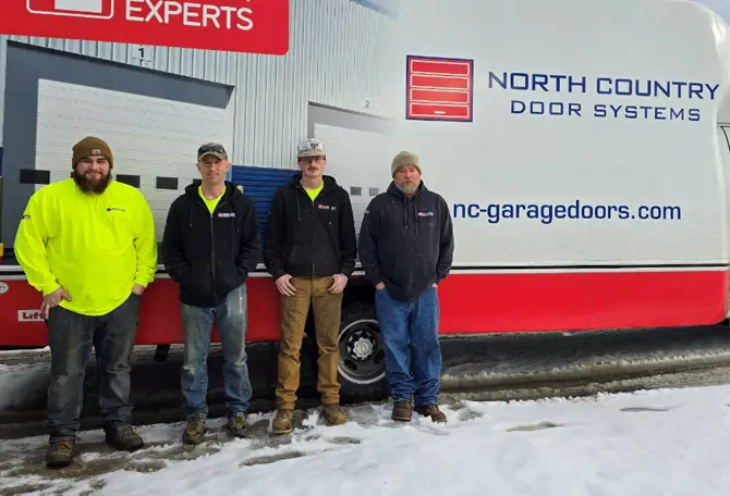 North Country Door Systems technicians in front of a truck services